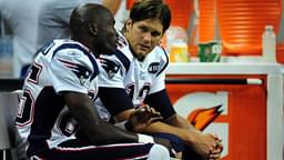 New England Patriots quarterback Tom Brady (right) talks to teammate wide receiver Chad Ochocinco (left) during the second half against the Detroit Lions at Ford Field. Lions won 34 to 10.