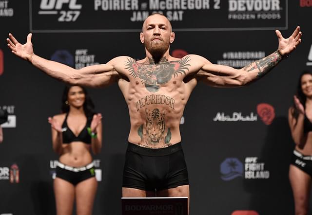  In this handout photo from Zuffa LLC Conor McGregor of Ireland poses on the scale during the UFC 257 weigh-in at Etihad Arena on UFC Fight Island on January 22, 2021 in Abu Dhabi.