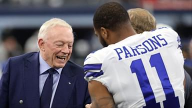 Dallas Cowboys owner Jerry Jones meets with outside linebacker Micah Parsons (11) prior to the NFC Wild Card playoff football game against the San Francisco 49ers at AT&T Stadium.