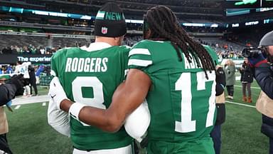 Jan 5, 2025; East Rutherford, New Jersey, USA; New York Jets quarterback Aaron Rodgers (8) and wide receiver Davante Adams (17) walk on the field after the Jets win over the Miami Dolphins at MetLife Stadium.