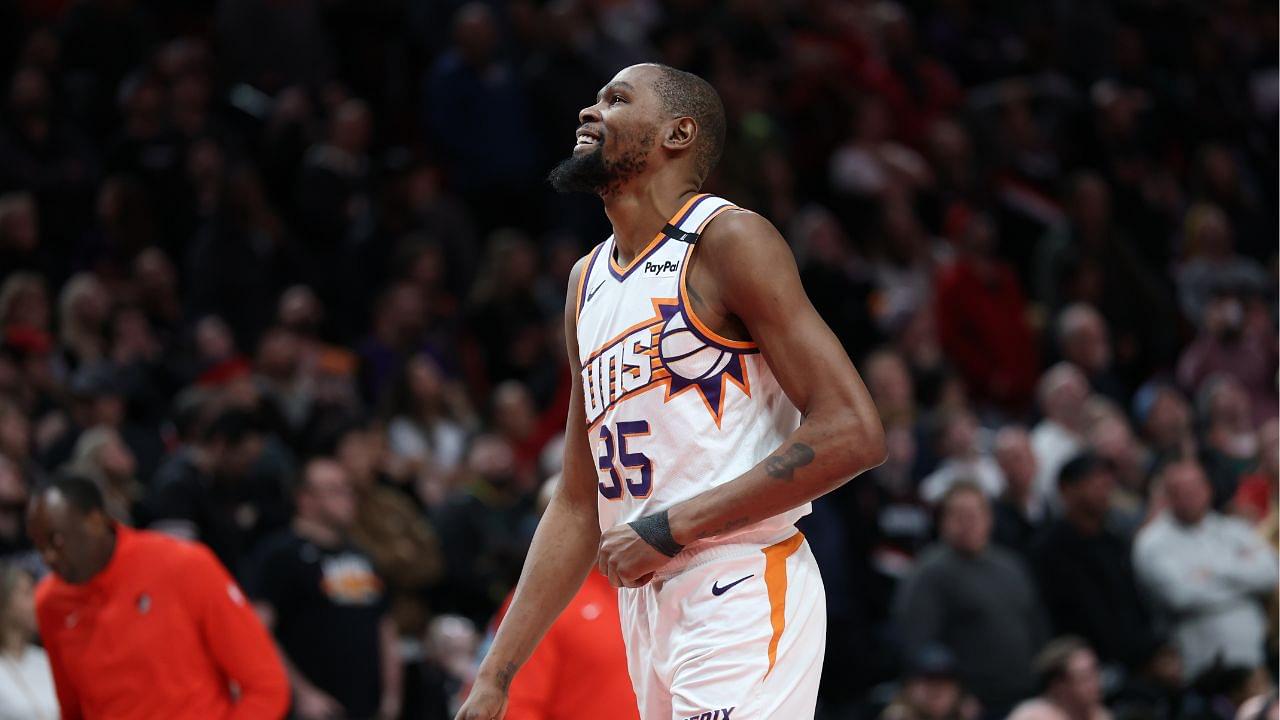 Phoenix Suns forward Kevin Durant (35) laughs as he watches a replay of his teammate Suns’ guard Devin Booker (1) being fouled by Portland Trail Blazers forward Deni Avdija (8) in overtime at Moda Center.