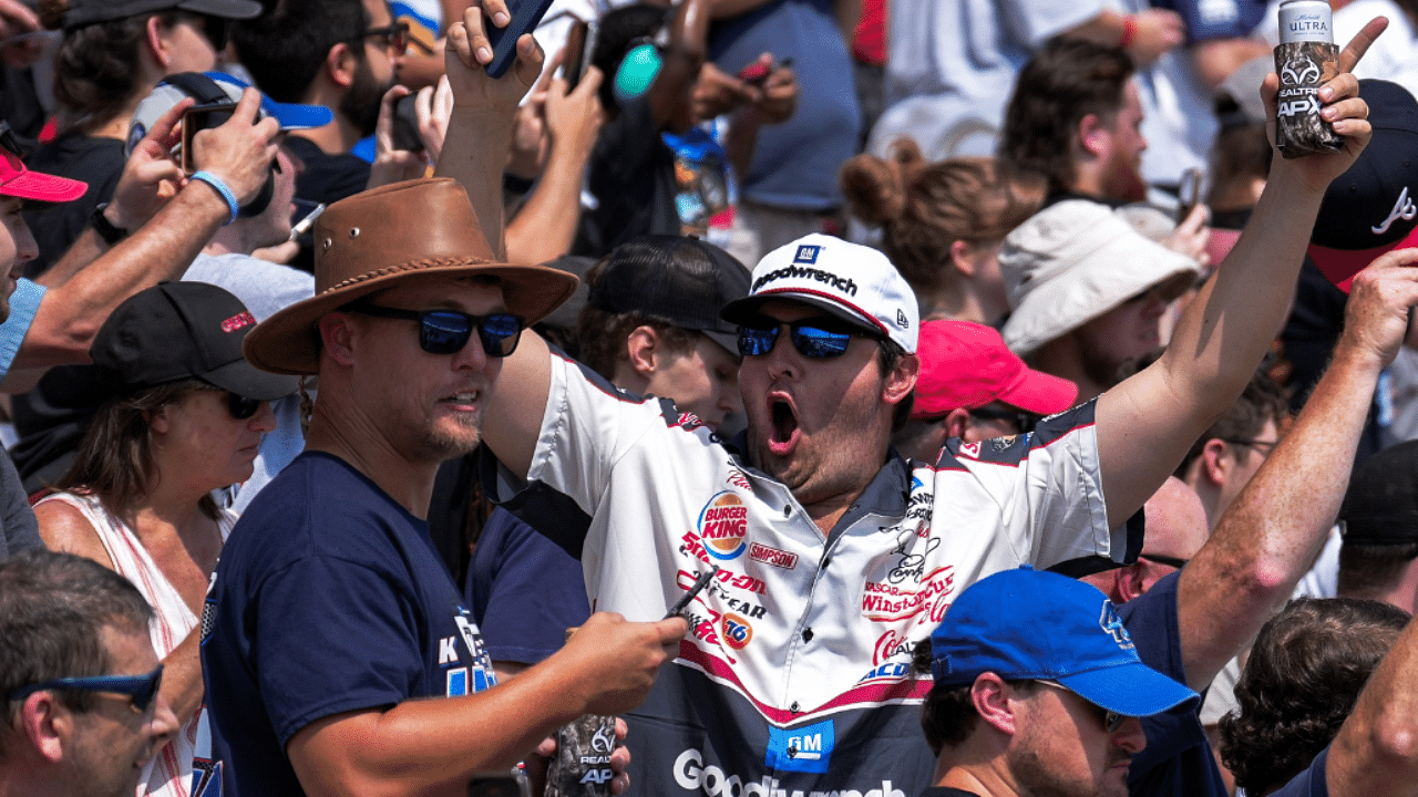 Fans cheer as the race begins at Atlanta Motor Speedway.