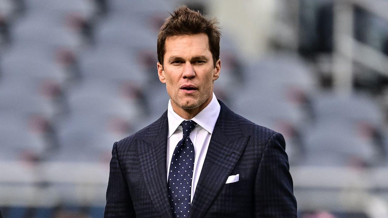 Former quarterback and current NFL announcer Tom Brady looks on before the game between the Chicago Bears and Green Bay Packers at Soldier Field.