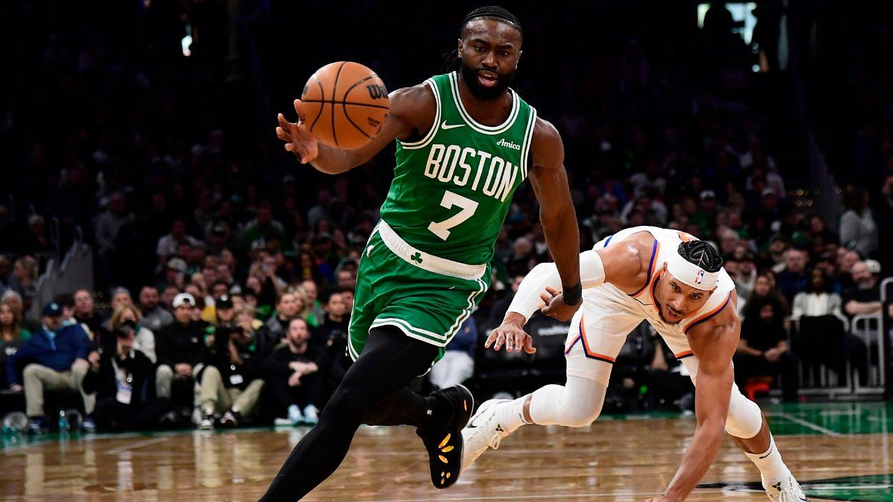 Boston Celtics guard Jaylen Brown (7) gains possession of the ball ahead of New York Knicks guard Josh Hart (3) during the second half at TD Garden.