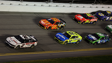 Feb 16, 2025; Daytona Beach, Florida, USA; NASCAR Cup Series driver Austin Cindric (2) leads the field during the Daytona 500 at Daytona International Speedway. Mandatory Credit: Mike Watters-Imagn Images