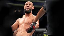 Khamzat Chimaev (red gloves) fights Kevin Holland (blue gloves) during UFC 279 at T-Mobile Arena.