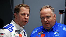 NASCAR Cup Series driver Brad Keselowski (6) talks to his crew chief Jeremy Bullins during practice for the Daytona 500 at Daytona International Speedway.