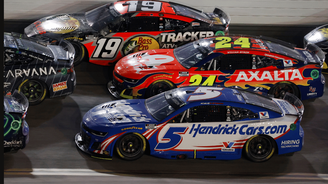 Feb 16, 2025; Daytona Beach, Florida, USA; NASCAR Cup Series driver Chase Briscoe (19), driver William Byron (24) and driver Kyle Larson (5) race three wide during the Daytona 500 at Daytona International Speedway. Mandatory Credit: Peter Casey-Imagn Images