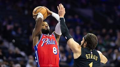 Philadelphia 76ers forward Paul George (8) shoots against Cleveland Cavaliers guard Max Strus (1) during the first quarter at Wells Fargo Center