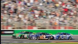 Sep 8, 2024; Hampton, Georgia, USA; NASCAR Cup Series driver Daniel Suarez (99), NASCAR Cup Series driver Joey Logano (22), and NASCAR Cup Series driver Ryan Blaney (12) fight for position along the stretch in the final laps at Atlanta Motor Speedway. Mandatory Credit: Jason Allen-Imagn Images