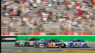 Sep 8, 2024; Hampton, Georgia, USA; NASCAR Cup Series driver Daniel Suarez (99), NASCAR Cup Series driver Joey Logano (22), and NASCAR Cup Series driver Ryan Blaney (12) fight for position along the stretch in the final laps at Atlanta Motor Speedway. Mandatory Credit: Jason Allen-Imagn Images