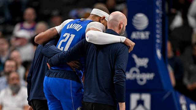 Dallas Mavericks center Daniel Gafford (21) is helped off the court during the second quarter against the Sacramento Kings at the American Airlines Center.