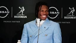 Colorado Buffaloes wide receiver/cornerback Travis Hunter smiles on stage during a press conference before the 2024 Heisman Trophy Presentation.