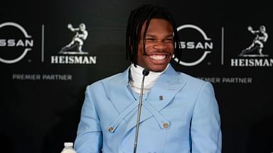 Colorado Buffaloes wide receiver/cornerback Travis Hunter smiles on stage during a press conference before the 2024 Heisman Trophy Presentation.