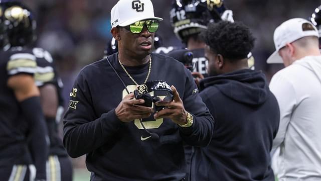 Colorado Buffaloes head coach Deion Sanders walks on the field between plays during the first quarter against the Brigham Young Cougars at Alamodome.