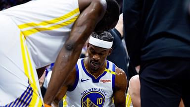 Golden State Warriors forward Jimmy Butler III (10) draws on a board with forward Draymond Green (23) during the second quarter against the Sacramento Kings at Golden 1 Center.