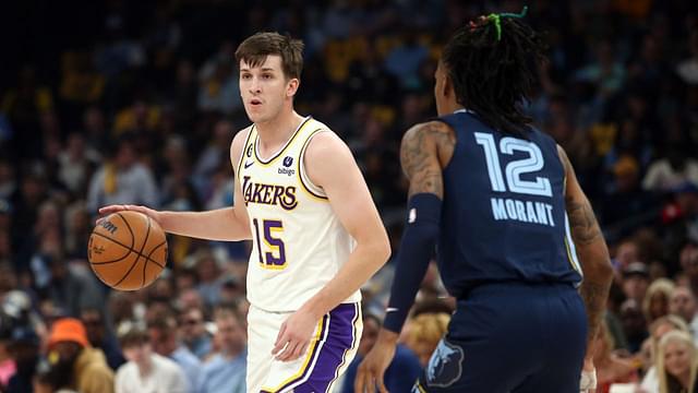 Los Angeles Lakers guard Austin Reaves (15) handles the ball as Memphis Grizzlies guard Ja Morant (12) defends during the first half during game one of the 2023 NBA playoffs at FedExForum.