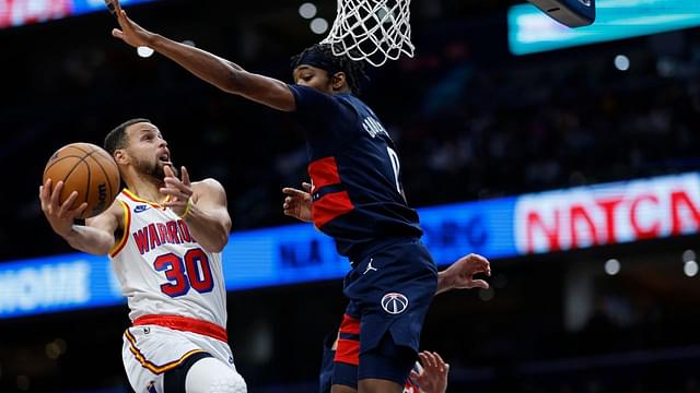 Golden State Warriors guard Stephen Curry (30) shoots the ball as Washington Wizards guard Bilal Coulibaly (0) defends in the second half at Capital One Arena