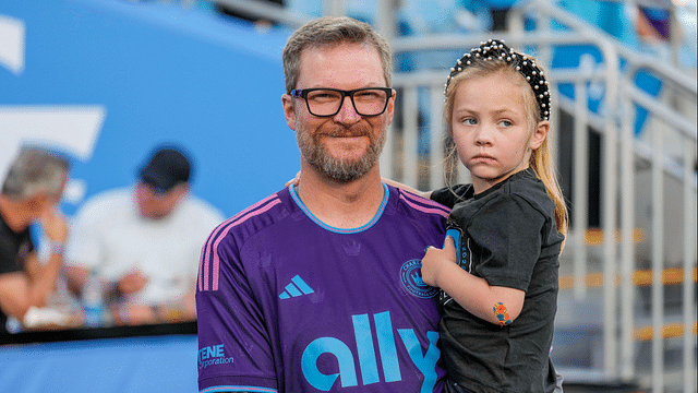 Apr 15, 2023; Charlotte, North Carolina, USA; Coronation guest Dale Earnhardt Jr. with his daughter Isla Rose during pregame warm ups between the Charlotte FC and the Colorado Rapids at Bank of America Stadium. Mandatory Credit: Jim Dedmon-Imagn Images