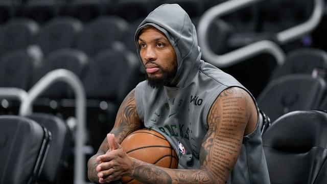 Milwaukee Bucks guard Damian Lillard (0) looks on during warmups prior to the game against the Orlando Magic at Fiserv Forum