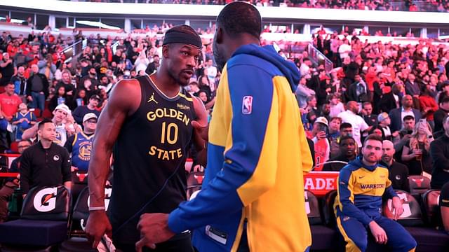 Golden State Warriors forward Jimmy Butler (10) talks with new teammate Draymond Green before taking on the Chicago Bulls at the United Center