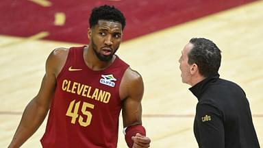 Cleveland Cavaliers guard Donovan Mitchell (45) talks to head coach Kenny Atkinson in the fourth quarter against the Houston Rockets at Rocket Mortgage FieldHouse.