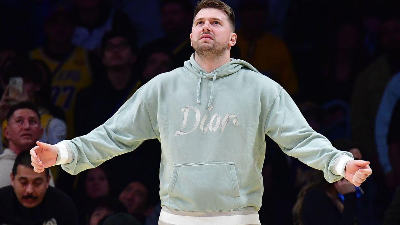 Los Angeles Lakers guard Luka Doncic (77) reacts watching game action against the Indiana Pacers during the second half at Crypto.com Arena.