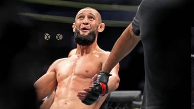 Khamzat Chimaev (red gloves) fights Kevin Holland (blue gloves) during UFC 279 at T-Mobile Arena.