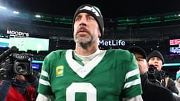 Jan 5, 2025; East Rutherford, New Jersey, USA; New York Jets quarterback Aaron Rodgers (8) walks on the field after the Jets win over the Miami Dolphins at MetLife Stadium.