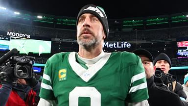 Jan 5, 2025; East Rutherford, New Jersey, USA; New York Jets quarterback Aaron Rodgers (8) walks on the field after the Jets win over the Miami Dolphins at MetLife Stadium.