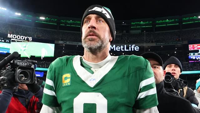 Jan 5, 2025; East Rutherford, New Jersey, USA; New York Jets quarterback Aaron Rodgers (8) walks on the field after the Jets win over the Miami Dolphins at MetLife Stadium.