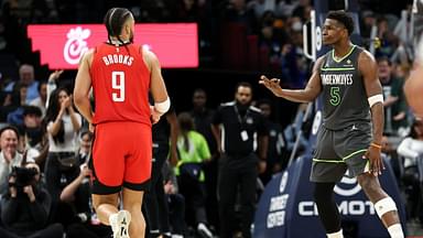 Minnesota Timberwolves guard Anthony Edwards (5) celebrates his three-point basket towards Houston Rockets forward Dillon Brooks (9) during the fourth quarter at Target Center.