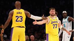 Los Angeles Lakers forward LeBron James (23) and guard Luka Doncic (77) celebrate after a play during the third quarter against the Charlotte Hornets at Crypto.com Arena