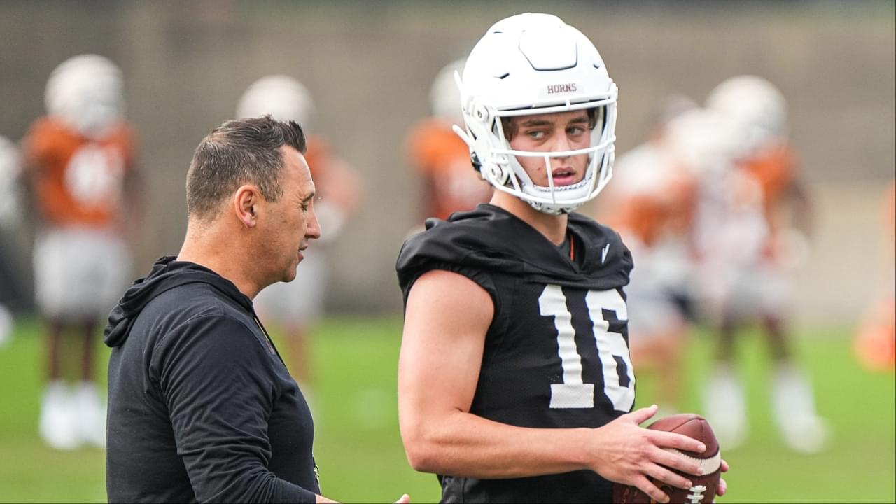 Texas head coach Steve Sarkisian talks to quarterback Arch Manning (16) during the first Texas Longhorns football practice of 2023 at the Frank Denius Fields on the University of Texas at Austin campus on Monday, March 6, 2023. Aem Texfoot First 2023 Practice 7