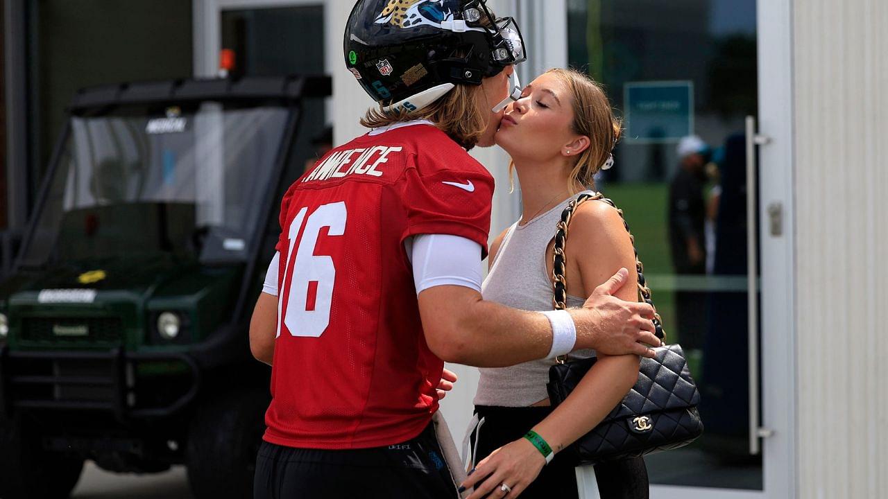 Jacksonville Jaguars quarterback Trevor Lawrence (16) kisses his wife Marissa Lawrence after a combined NFL football training camp session between the Tampa Bay Buccaneers and Jacksonville Jaguars Thursday, Aug. 15, 2024 at EverBank Stadium’s Miller Electric Center in Jacksonville, Fla.