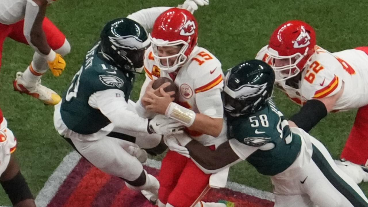 Feb 9, 2025; New Orleans, LA, USA; Kansas City Chiefs quarterback Patrick Mahomes (15) is pressured by Philadelphia Eagles linebacker Josh Sweat (19) and Philadelphia Eagles linebacker Jalyx Hunt (58) in the second quarter during Super Bowl LIX at Caesars Superdome.