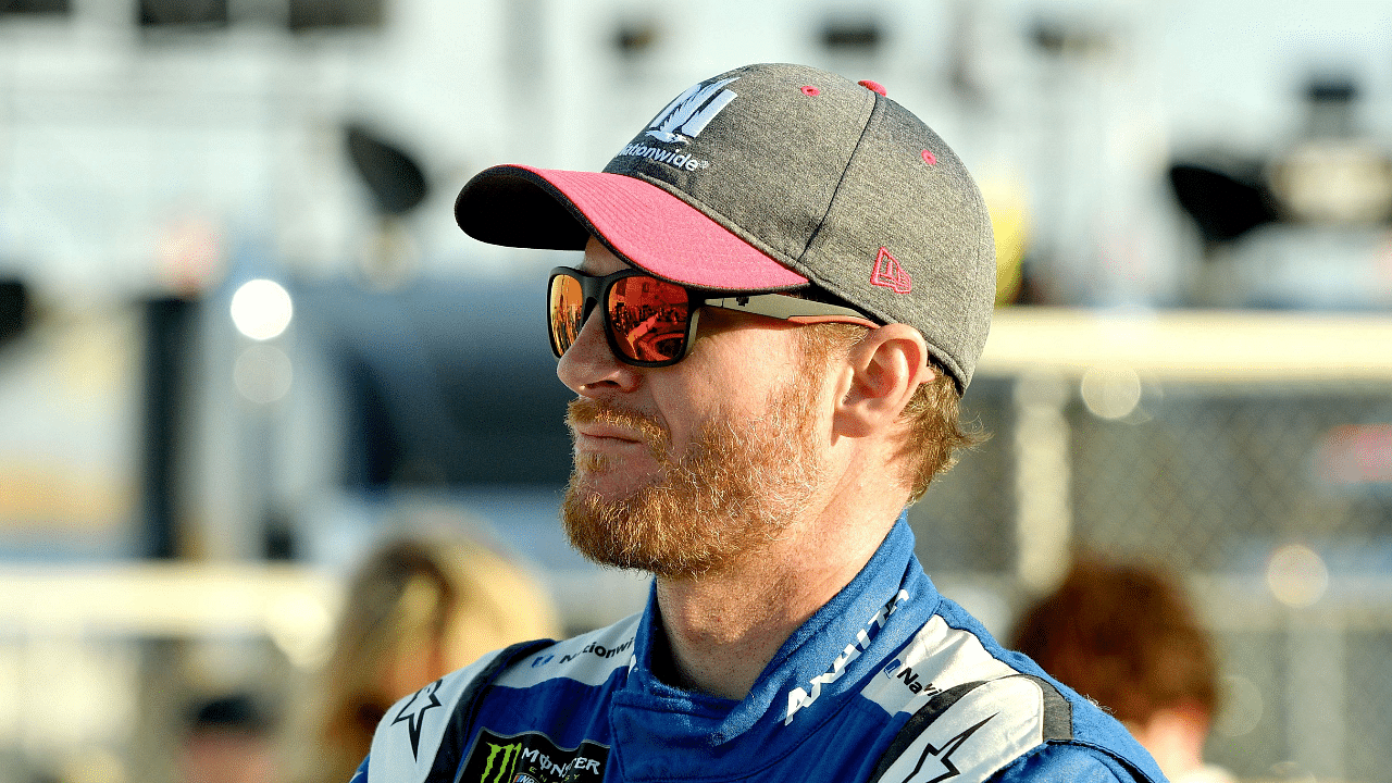 NASCAR Cup Series driver Dale Earnhardt Jr. (88) waits by his car during qualifying for the Hollywood Casino 400 at Kansas Speedway.