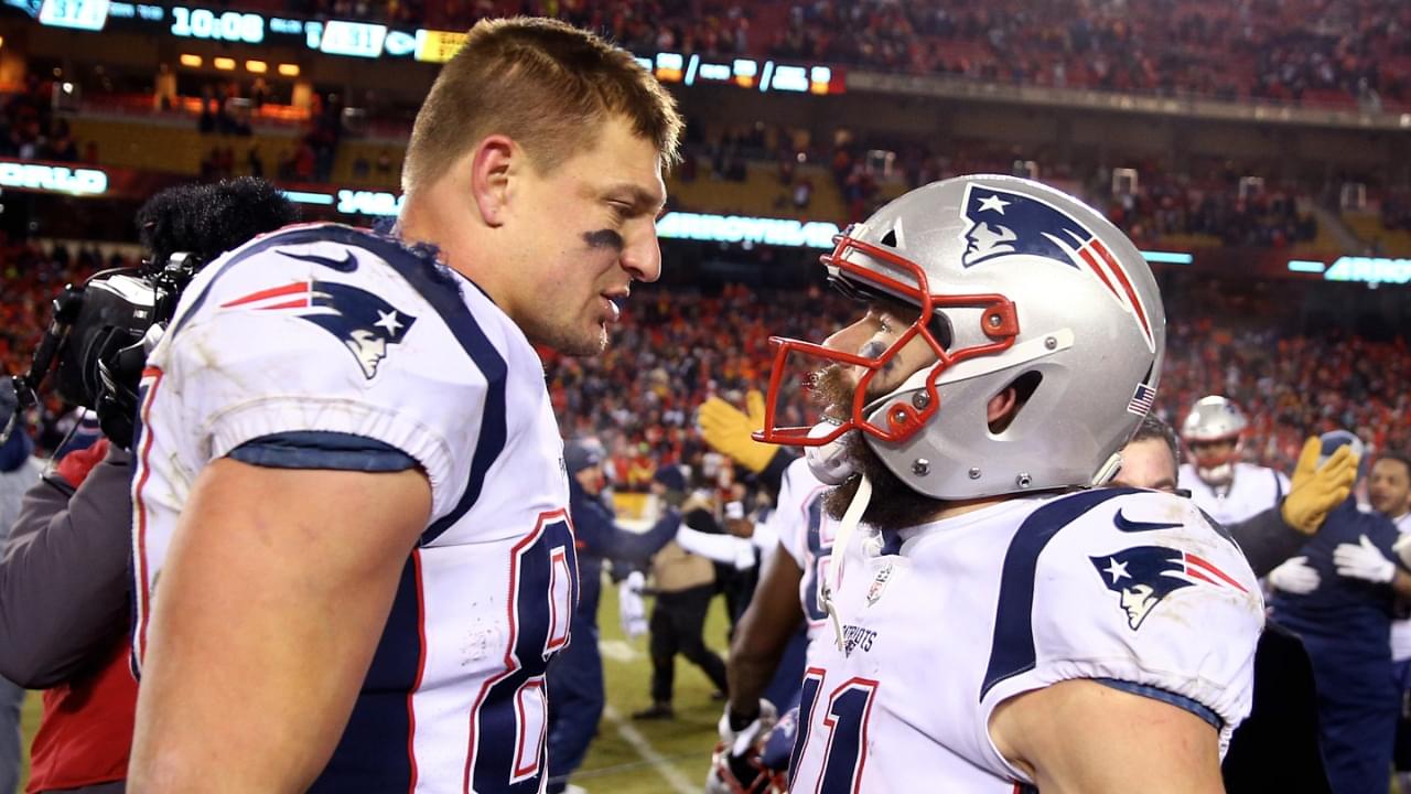 New England Patriots wide receiver Julian Edelman (11) celebrates with tight end Rob Gronkowski (87) after defeating the Kansas City Chiefs in overtime of the AFC Championship game at Arrowhead Stadium.