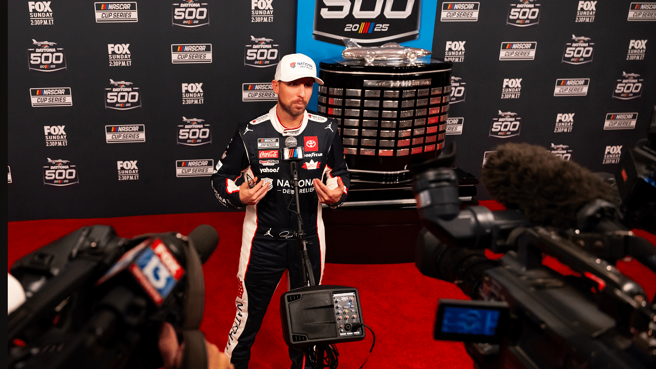 Feb 12, 2025; Daytona Beach, Florida, USA; NASCAR Cup Series driver Denny Hamlin during Daytona 500 media day at Daytona International Speedway. Mandatory Credit: Mark J. Rebilas-Imagn Images