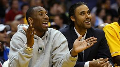 Injured Lakers' Kobe Bryant (left) and Rick Fox watch teammates during second half action of Los Angeles' 97 - 71 win over Denver at Staples Center.