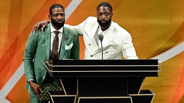 Dwyane Wade (right) calls his father Dwyane Wade Sr. (left) onto the stage at his induction into the 2023 Basketball Hall of Fame at Symphony Hall.