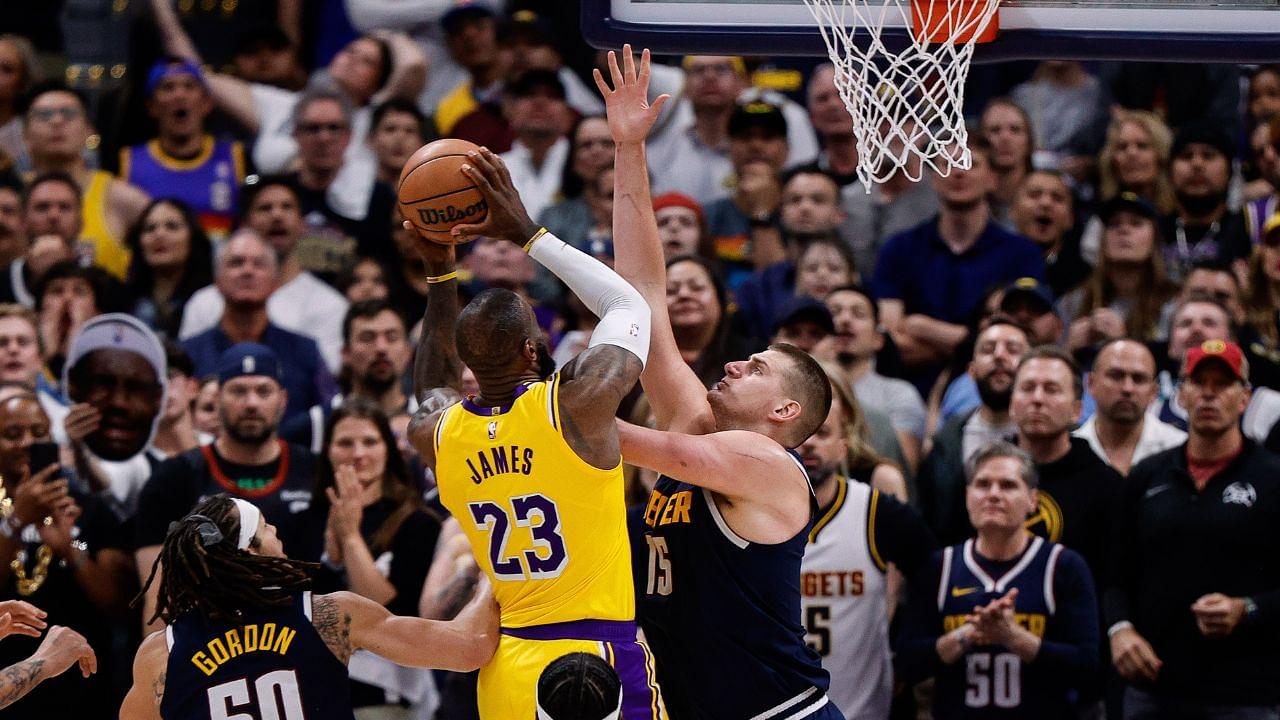 Los Angeles Lakers forward LeBron James (23) drives to the net against Denver Nuggets center Nikola Jokic (15) in the fourth quarter during game five of the first round for the 2024 NBA playoffs at Ball Arena.