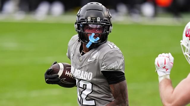 Nov 16, 2024; Boulder, Colorado, USA; Colorado Buffaloes wide receiver Travis Hunter (12) carries the ball for a touchdown in the fourth quarter against the Utah Utes at Folsom Field.