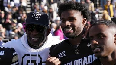 Nov 29, 2024; Boulder, Colorado, USA; Colorado Buffaloes safety Shilo Sanders (21) and head coach Deion Sanders and quarterback Shedeur Sanders (2) and social media producer Deion Sanders Jr. following the win against the Oklahoma State Cowboys at Folsom Field.