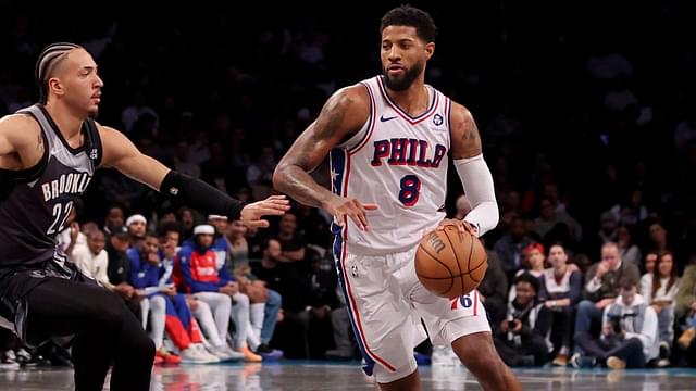 Philadelphia 76ers forward Paul George (8) brings the ball up court against Brooklyn Nets forward Jalen Wilson (22) during the fourth quarter at Barclays Center.