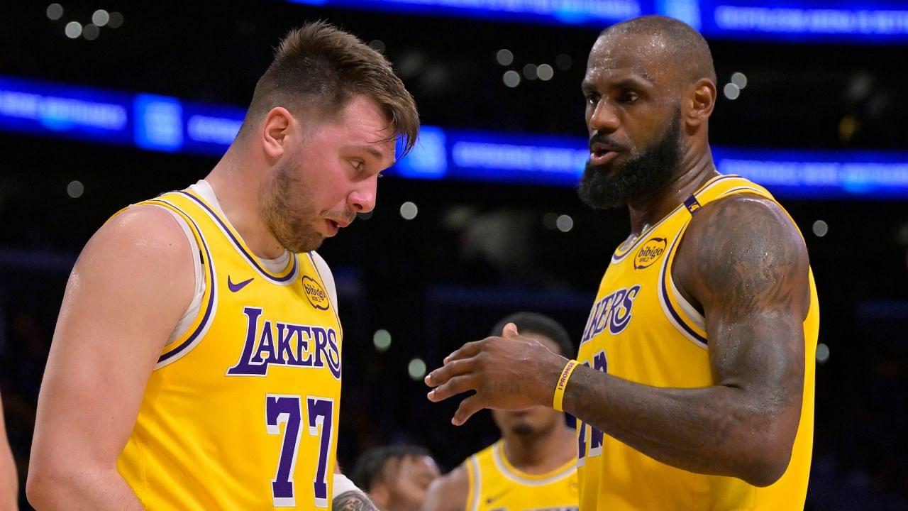 Los Angeles Lakers forward LeBron James (23) checks on guard Luka Doncic (77) after he was hit in the face against the Utah Jazz at Crypto.com Arena