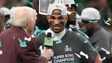 Feb 9, 2025; New Orleans, LA, USA; Philadelphia Eagles quarterback Jalen Hurts (1) talks with Fox announcer Terry Bradshaw after defeating the Kansas City Chiefs in Super Bowl LIX at Ceasars Superdome.