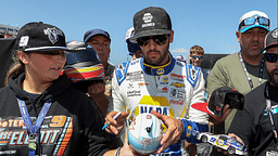 Aug 19, 2023; Watkins Glen, New York, USA; NASCAR Cup Series driver Chase Elliott signs autographs for fans during practice and qualifying for the Go Bowling at The Glen at Watkins Glen International. Mandatory Credit: Matthew O'Haren-Imagn Images