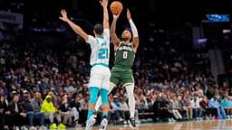 Milwaukee Bucks guard Damian Lillard (0) shoots the jumper over Charlotte Hornets guard KJ Simpson (25) during the second quarter at Spectrum Center.