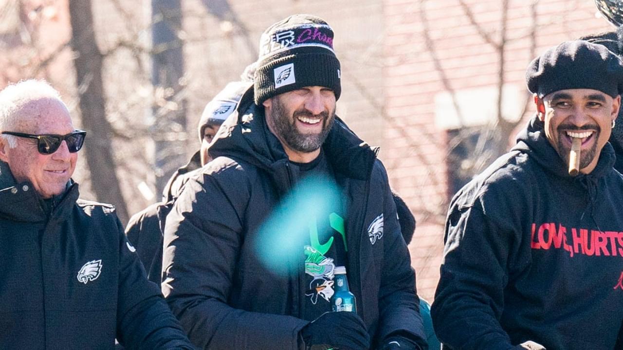 Philadelphia Eagles owner Jeffrey Lurie, left, joins head coach Nick Sirianni and quarterback Jalen Hurts atop one of the team buses during the Super Bowl 59 victory parade along South Broad Street in Philadelphia on Friday, Feb. 14, 2025.